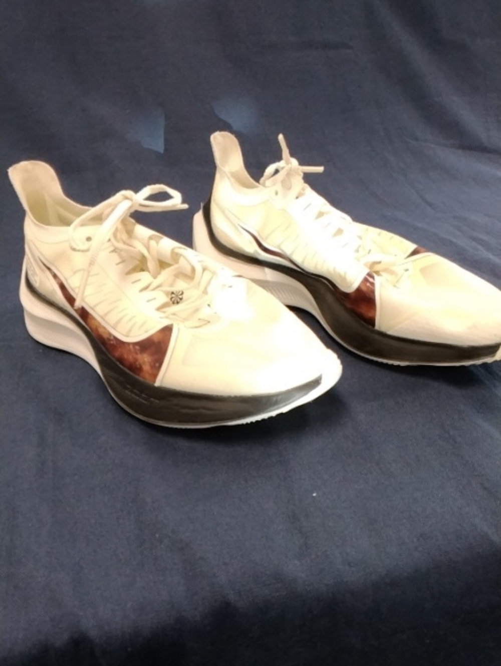Nike Women's White Athletic Sneakers with Brown Accent